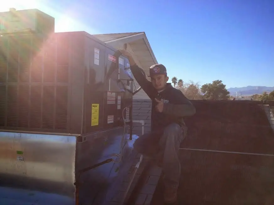 HVAC technician performing HVAC Inspection on a rooftop unit in East San Gabriel